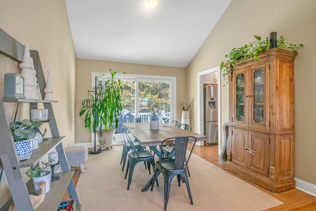 92 Wiltshire Rd, Scarsdale, NY 10583 - dining room featuring lofted ceiling and light wood-type flooring