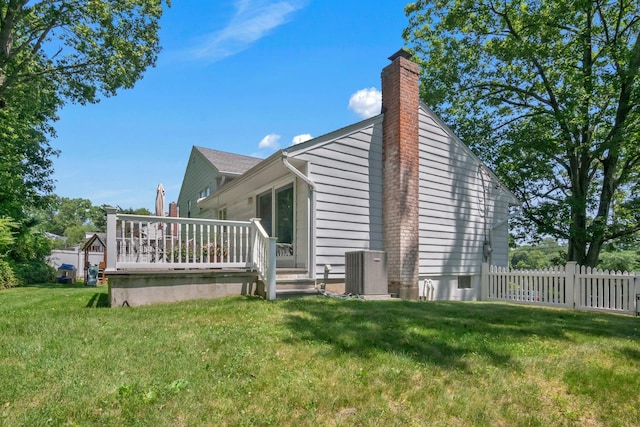 92 Wiltshire Rd, Scarsdale, NY 10583 - view of property exterior with a wooden deck and a chimney