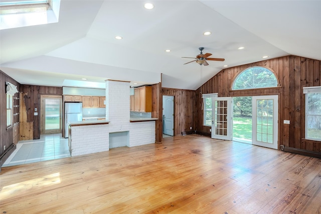 82A Union Ave, Center Moriches, NY 11934 - unfurnished living room featuring wooden walls, vaulted ceiling, a ceiling fan, light wood finished floors, and recessed lighting