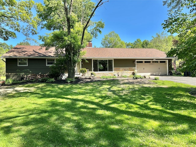 282 Petticoat Ln, Bloomingburg, NY 12721 - single story home featuring driveway, a chimney, a garage, and a front yard