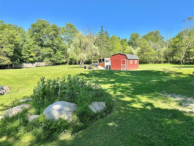 282 Petticoat Ln, Bloomingburg, NY 12721 - view of green lawn featuring an outbuilding and a view of trees
