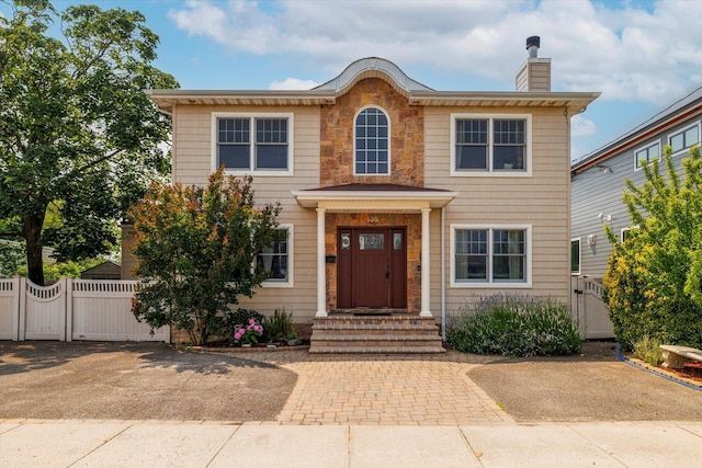 135 Flamingo St, Atlantic Beach, NY 11509 - view of front of property with a gate and a chimney