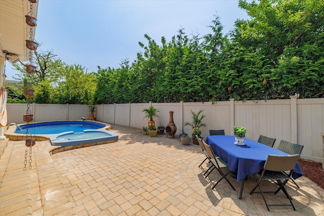 135 Flamingo St, Atlantic Beach, NY 11509 - view of pool with a patio area, a fenced backyard, a jacuzzi, and outdoor dining space