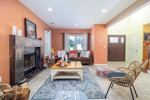 135 Flamingo St, Atlantic Beach, NY 11509 - living area with plenty of natural light, a tile fireplace, recessed lighting, and light tile patterned floors