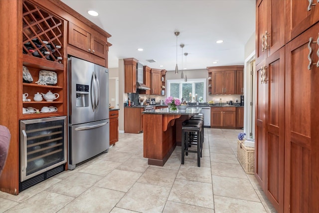 135 Flamingo St, Atlantic Beach, NY 11509 - kitchen featuring beverage cooler, stainless steel appliances, open shelves, a center island, and brown cabinetry