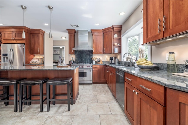 135 Flamingo St, Atlantic Beach, NY 11509 - kitchen with wall chimney range hood, stainless steel appliances, open shelves, dark stone countertops, and a breakfast bar