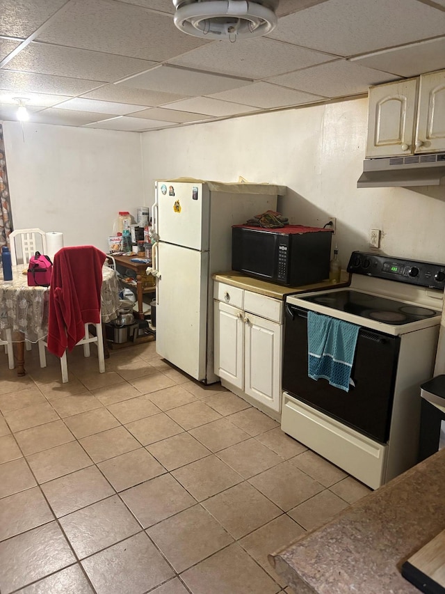 40 Samuel St, Ronkonkoma, NY 11779 - kitchen featuring white range with electric cooktop, under cabinet range hood, black microwave, a paneled ceiling, and light tile patterned floors