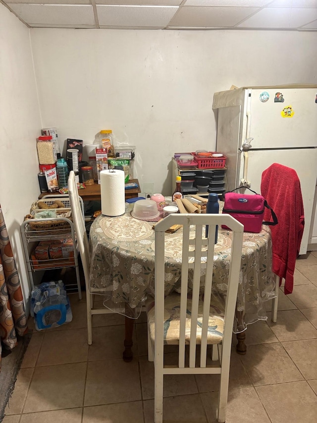 40 Samuel St, Ronkonkoma, NY 11779 - dining area with tile patterned flooring and a drop ceiling