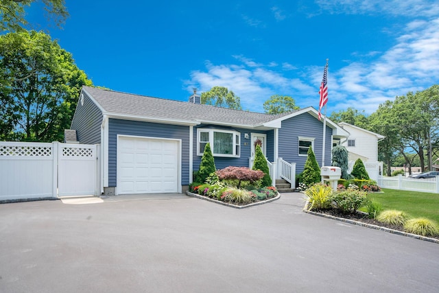 47 Tucker Dr, Bayport, NY 11705 - ranch-style home with an attached garage, driveway, and roof with shingles