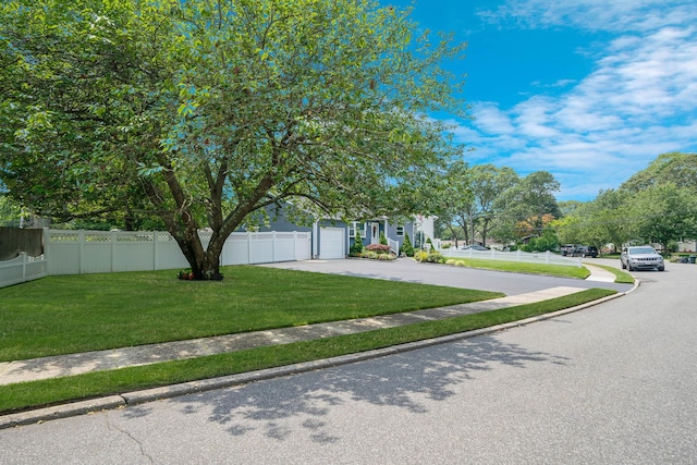 47 Tucker Dr, Bayport, NY 11705 - obstructed view of property featuring concrete driveway and a garage