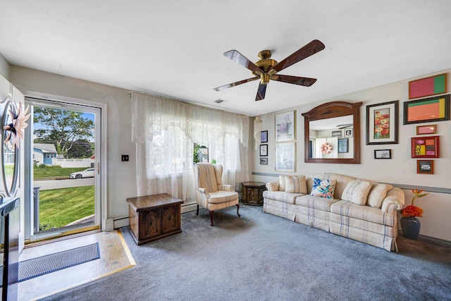 47 Tucker Dr, Bayport, NY 11705 - living area featuring carpet, ceiling fan, and a baseboard radiator