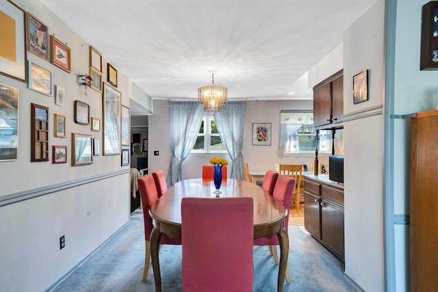 47 Tucker Dr, Bayport, NY 11705 - dining space with light carpet and a chandelier