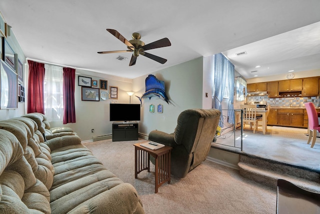 47 Tucker Dr, Bayport, NY 11705 - living area featuring light carpet, ceiling fan, a baseboard heating unit, and recessed lighting