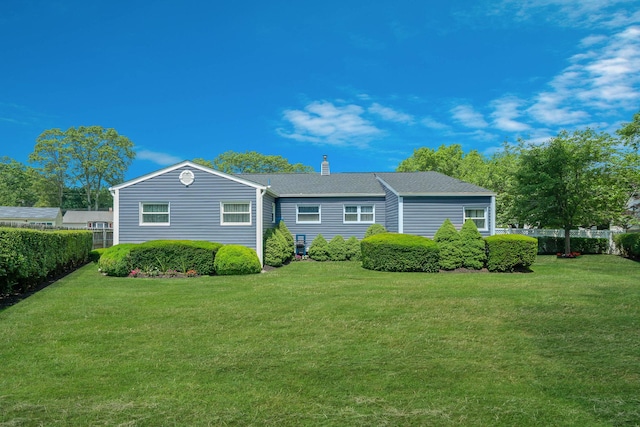 47 Tucker Dr, Bayport, NY 11705 - back of property featuring a chimney and a yard
