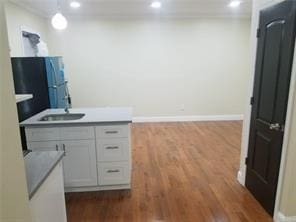 2718 Holland Ave, Bronx, NY 10467 - kitchen with dark wood-style floors, recessed lighting, and hanging light fixtures
