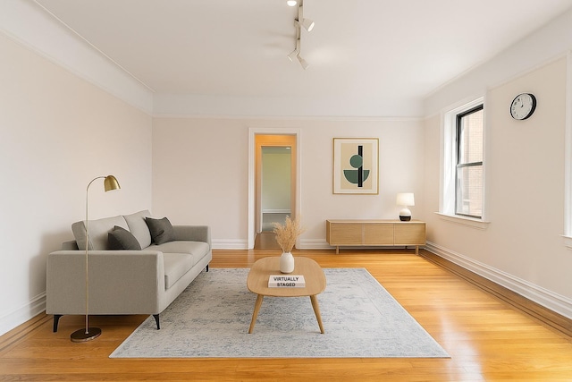 83-10 35th Ave Unit 5B, Jackson Heights, NY 11372 - living area with light wood finished floors and track lighting