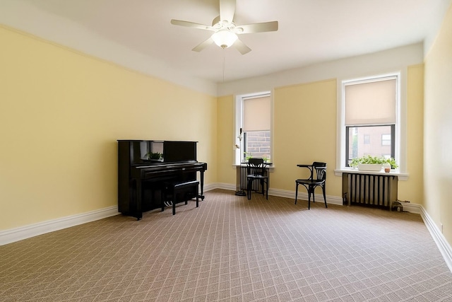 83-10 35th Ave Unit 5B, Jackson Heights, NY 11372 - sitting room featuring radiator heating unit, a ceiling fan, carpet flooring, and plenty of natural light