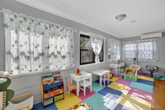 439 S 7th Ave, Mount Vernon, NY 10550 - recreation room featuring a wall mounted AC and tile patterned floors