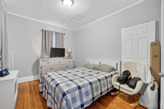 439 S 7th Ave, Mount Vernon, NY 10550 - bedroom with light wood-style flooring and crown molding