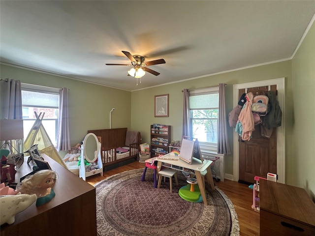 226 James St, Franklin Square, NY 11010 - office with ceiling fan, wood finished floors, and crown molding