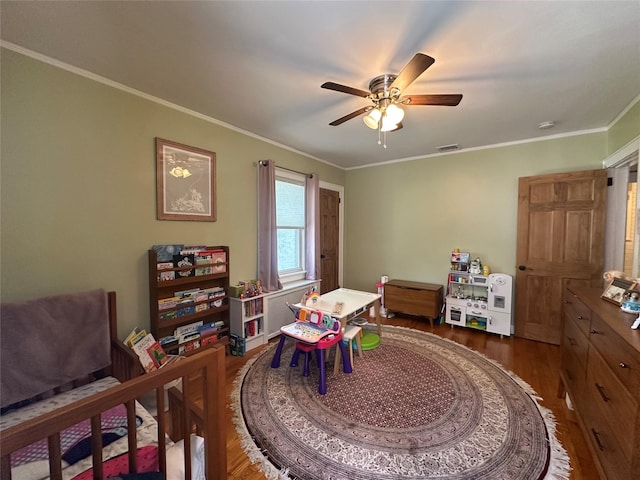 226 James St, Franklin Square, NY 11010 - game room featuring wood finished floors, ceiling fan, and crown molding