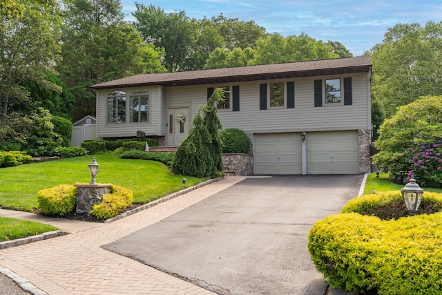 11 Val Ct, Commack, NY 11725 - bi-level home featuring an attached garage, driveway, a front yard, and stone siding