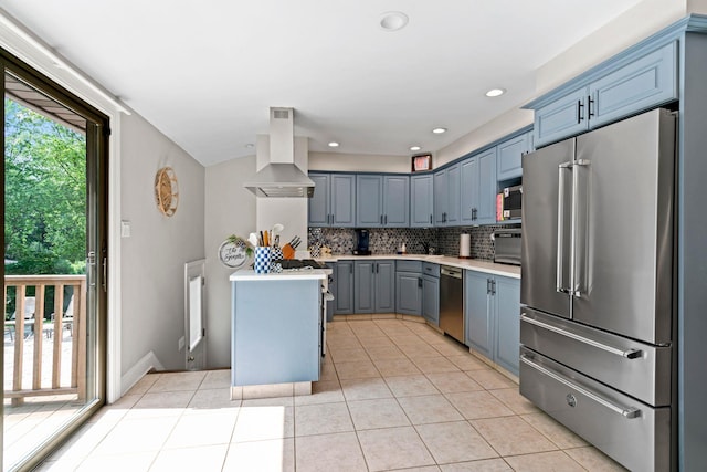 11 Val Ct, Commack, NY 11725 - kitchen with stainless steel appliances, island range hood, light countertops, and light tile patterned floors