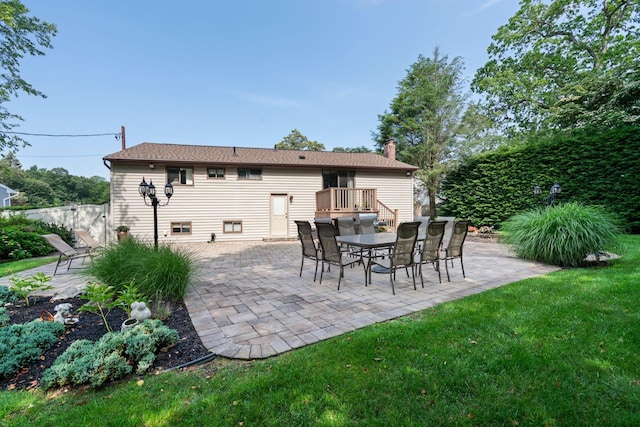 11 Val Ct, Commack, NY 11725 - rear view of property featuring a chimney, a patio area, and outdoor dining area