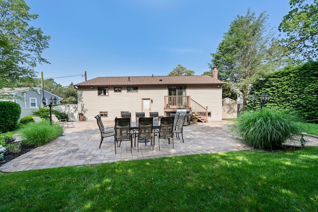 11 Val Ct, Commack, NY 11725 - back of house with a chimney and a patio area