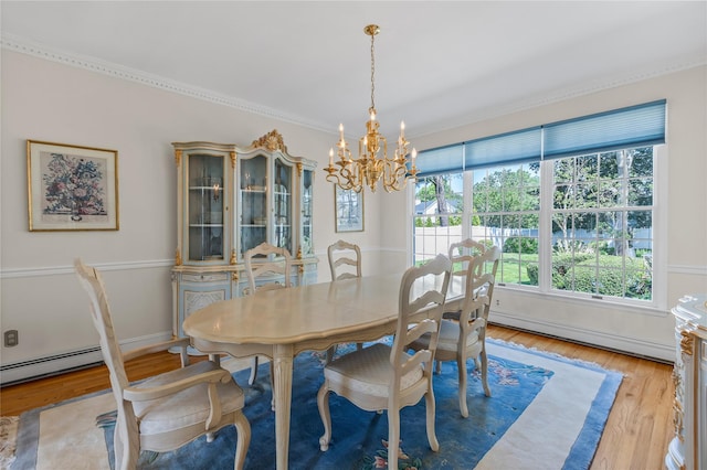 17 Pheasant Run Ln, Dix Hills, NY 11746 - dining space featuring a baseboard heating unit, a chandelier, wood finished floors, crown molding, and baseboard heating