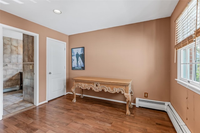 17 Pheasant Run Ln, Dix Hills, NY 11746 - sitting room with baseboard heating, wood finished floors, and recessed lighting