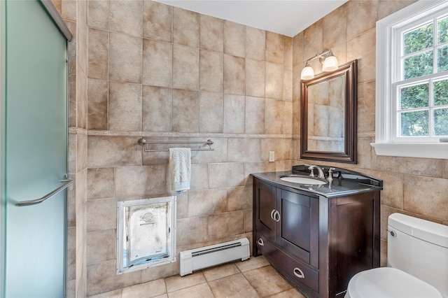 17 Pheasant Run Ln, Dix Hills, NY 11746 - full bathroom featuring a baseboard heating unit, tile walls, vanity, an enclosed shower, and tile patterned flooring