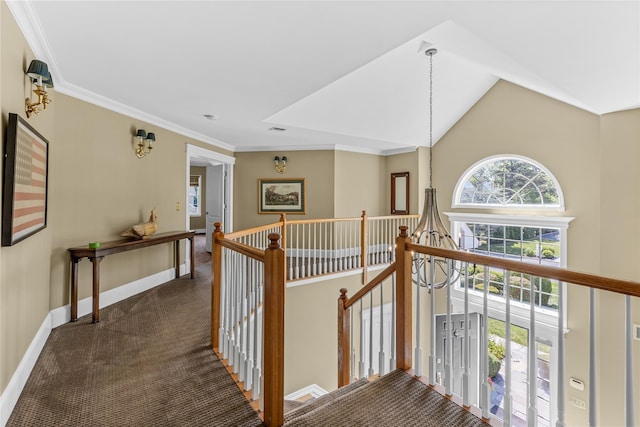 17 Pheasant Run Ln, Dix Hills, NY 11746 - hallway with an upstairs landing, dark carpet, crown molding, a chandelier, and vaulted ceiling