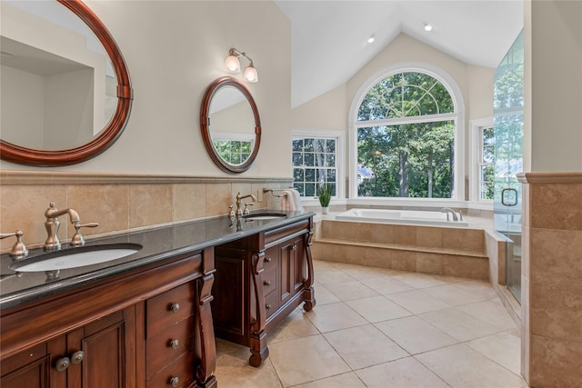 17 Pheasant Run Ln, Dix Hills, NY 11746 - bathroom featuring double vanity, a garden tub, tile patterned floors, a wainscoted wall, and lofted ceiling