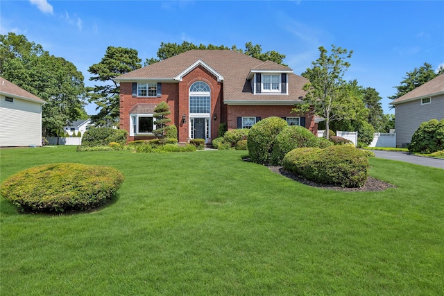 17 Pheasant Run Ln, Dix Hills, NY 11746 - view of front of property featuring brick siding, a front lawn, and a shingled roof
