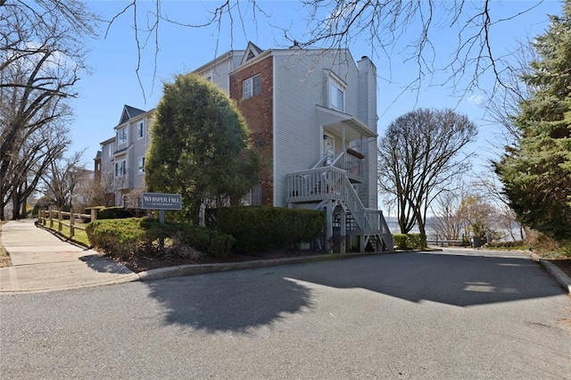 29D Windle Park Unit D, Tarrytown, NY 10591 - view of home's exterior featuring stairway and a chimney
