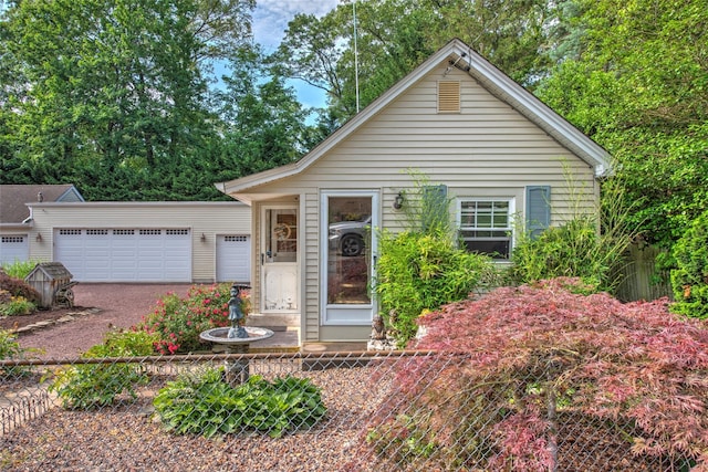 62 Port Washington Rd, Sound Beach, NY 11789 - view of front facade with driveway and an attached garage