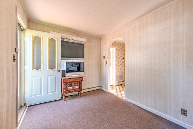 62 Port Washington Rd, Sound Beach, NY 11789 - living area featuring arched walkways, carpet floors, crown molding, baseboard heating, and wallpapered walls