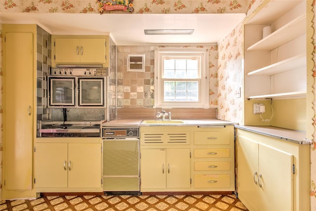62 Port Washington Rd, Sound Beach, NY 11789 - kitchen featuring open shelves, wallpapered walls, light floors, cream cabinetry, and stovetop