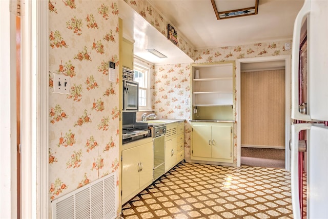 62 Port Washington Rd, Sound Beach, NY 11789 - kitchen featuring fridge, wallpapered walls, dishwasher, green cabinets, and stainless steel gas stovetop