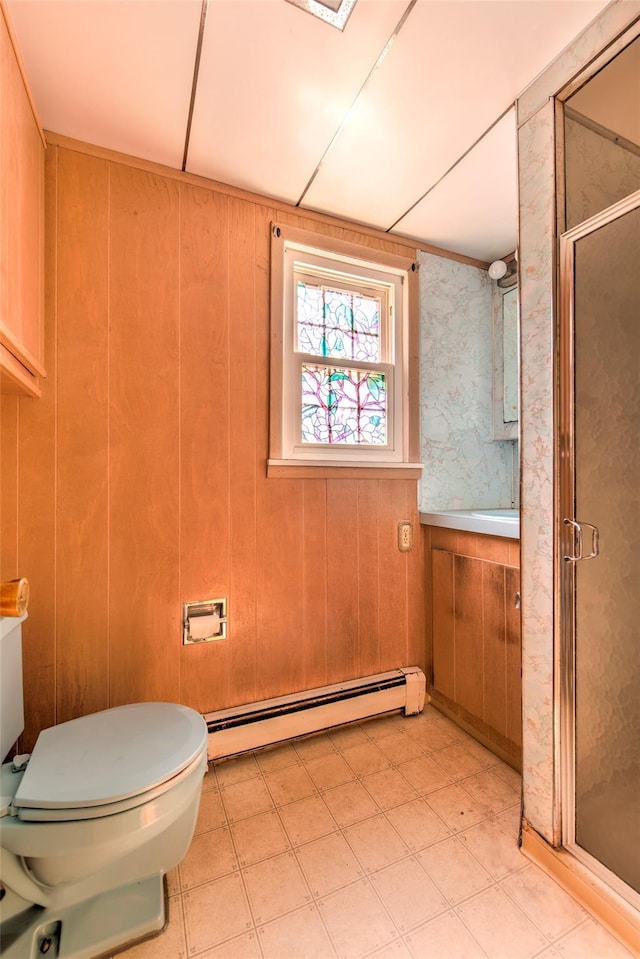 62 Port Washington Rd, Sound Beach, NY 11789 - full bath featuring a baseboard heating unit, a stall shower, tile patterned floors, and wood walls