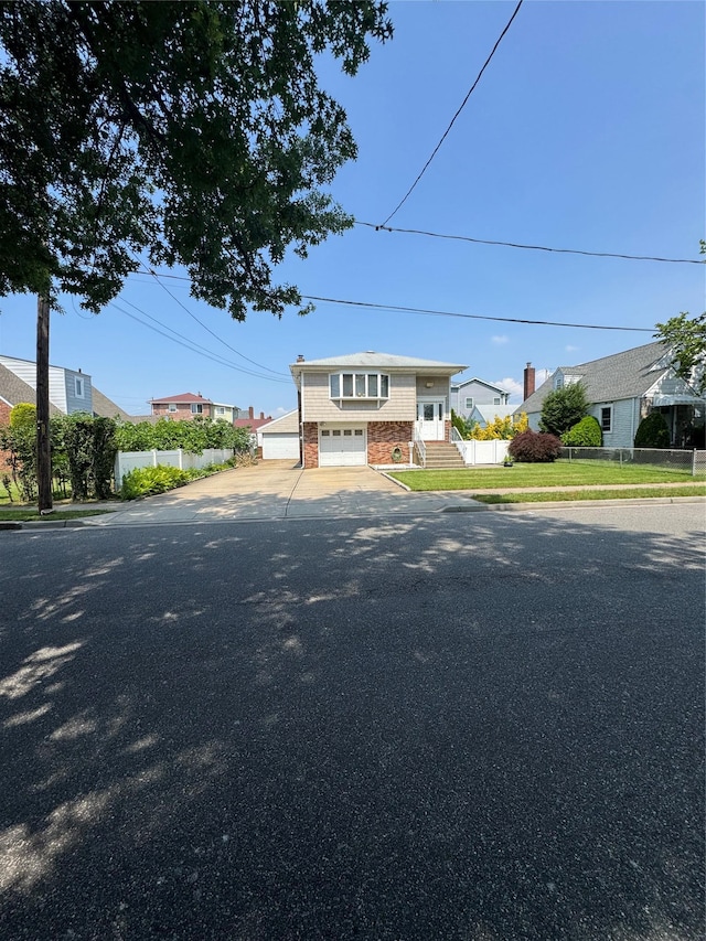 14 Edwards Pl, Valley Stream, NY 11580 - raised ranch with an attached garage and asphalt driveway