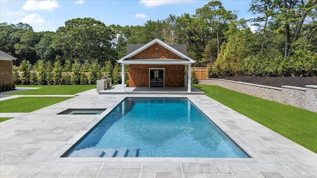 128 Sandy Hollow Rd, Southampton, NY 11968 - view of swimming pool with an exterior structure, an outbuilding, a patio area, and an in-ground hot tub