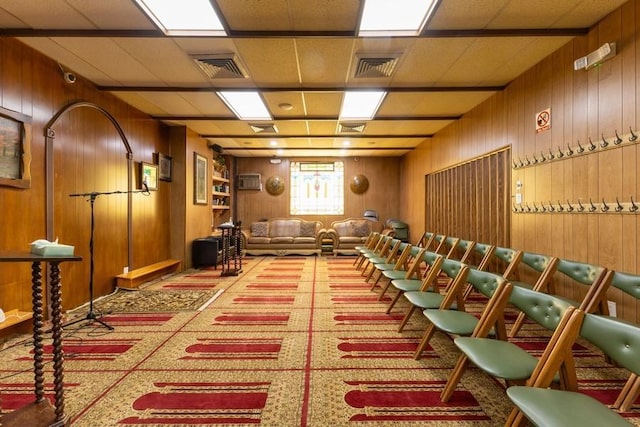 5836 Catalpa Ave, Ridgewood, NY 11385 - miscellaneous room with carpet flooring and wood walls