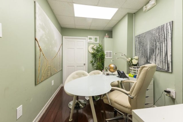 5836 Catalpa Ave, Ridgewood, NY 11385 - dining space featuring wood finished floors, a desk, and a paneled ceiling