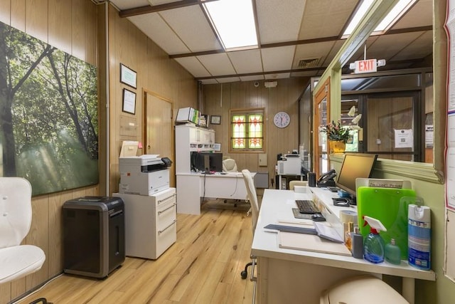5836 Catalpa Ave, Ridgewood, NY 11385 - home office with wood walls and light wood-style flooring