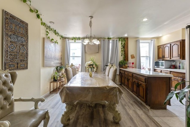 5836 Catalpa Ave, Ridgewood, NY 11385 - dining space with a chandelier, light wood-style floors, and recessed lighting