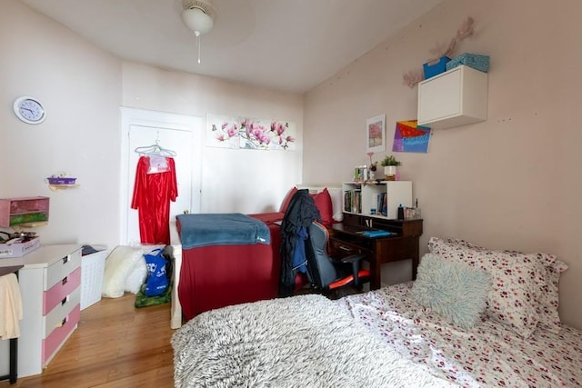5836 Catalpa Ave, Ridgewood, NY 11385 - bedroom with light wood finished floors and a ceiling fan