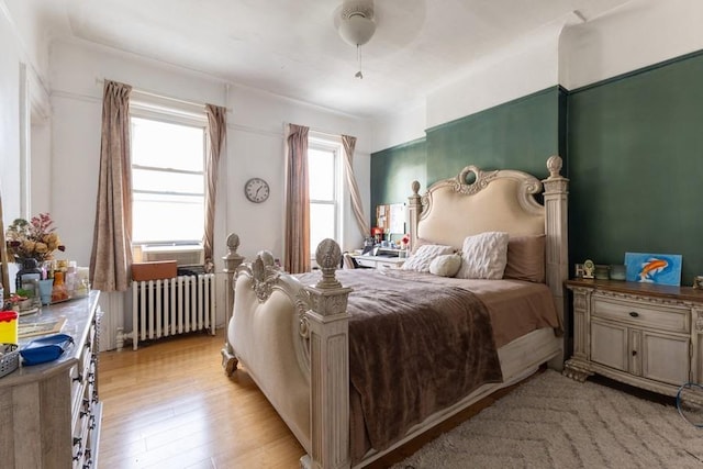 5836 Catalpa Ave, Ridgewood, NY 11385 - bedroom featuring radiator and light wood-type flooring