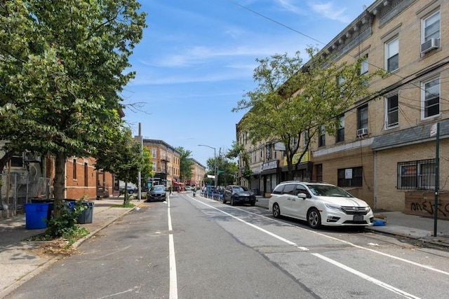 5836 Catalpa Ave, Ridgewood, NY 11385 - view of asphalt street featuring curbs, sidewalks, and street lights